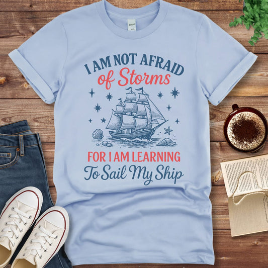 Printful T-shirt Light Blue / S Little Women Quote Shirt – I Am Not Afraid of Storms